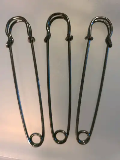 Three 4 inch kilt pins in gunmetal tone. Brand new. 3 sets available. Porch pickup in Kitchener. EFT...