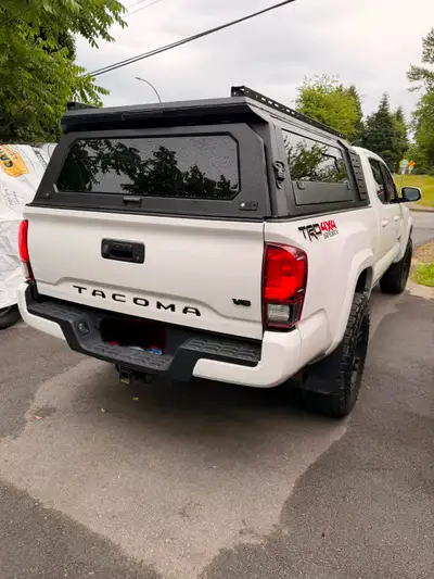 Brand new aluminum canopy Complete kit is brand new in the box. Includes everything, hardware, seals...