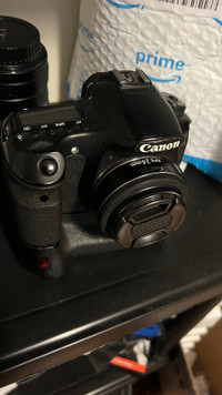 Canon 60D camera with battery grip and 24mm f2.8 lens