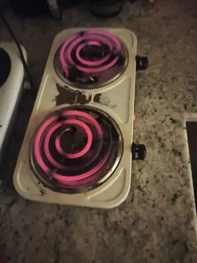 This is a two burner portable electric cooking stove with dual temperature controls, and is in used...