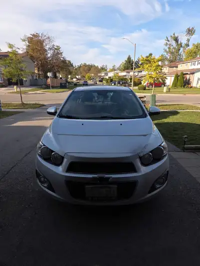 2014 Chevy Sonic has 141 853 kms on it. Some rusting on doors. Does require some work to be complete...