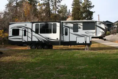 2015 Heartland Torque TQ380 with a difference 43’ triple axle 12’ toy hauler area 5500 watt Onan gen...