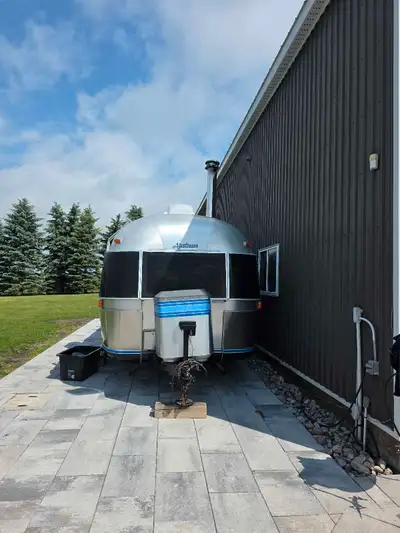 Immaculate, fully renovated and customized Airstream. Very rare for the shape.