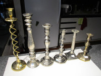 Various brass single candle holders.