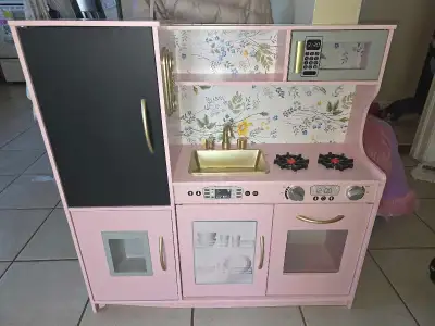 pink kicthen for toddler with chalk board on fridge, View more