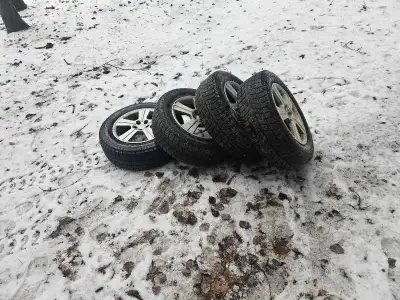 Bridgestone Blizzak winter tires on Subaru alloy rims. Been sitting in the shed for a year or two bu...