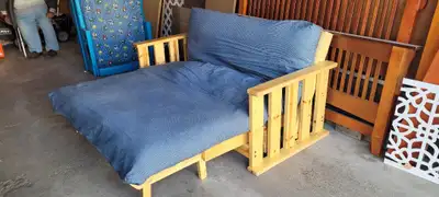 Queen Sized Maple Futon Frame. 32" X 65" X 36". Mattress is roughly 70" X 53". Folds from Couch to r...