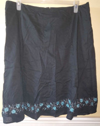 Reitmans Black skirt with blue flower design on bottom size 16