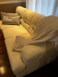 Two white leather sofas 