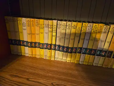 Vintage Nancy Drew yellow hard cover books, View more