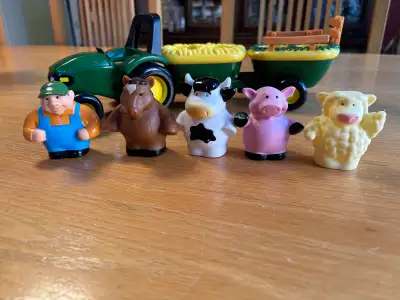 Complete John Deere farm set. Has green tractor, two wagons, farmer figure, horse figure, cow figure...