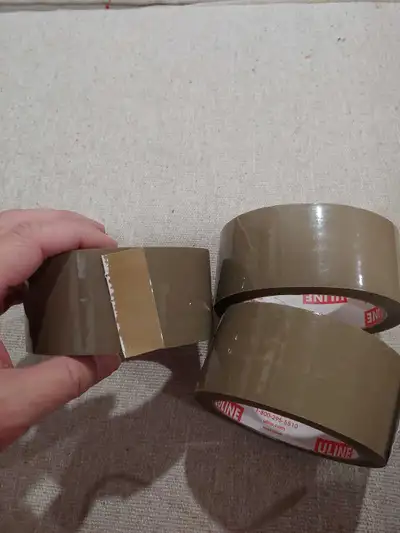 Three rolls of Uline packing tape. They are all partially used roll. Great for moving or shipping. $...