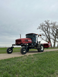 Macdon M205 swather with 16' R85 disc header