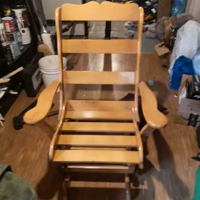 Glider rocker, solid wood. Great condition. The white marks you see on the chair is just the lightin...