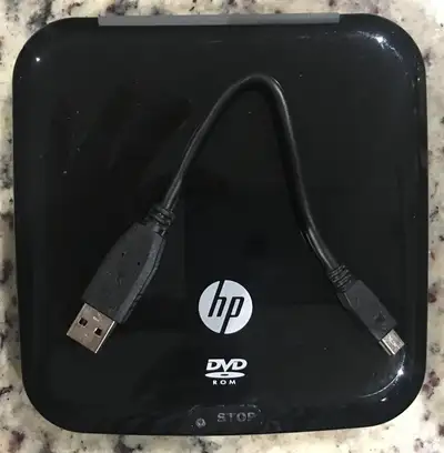I am selling HP RM475E 8x External Slim DVD-ROM Portable Drive with USB Cable. - Reads all major for...