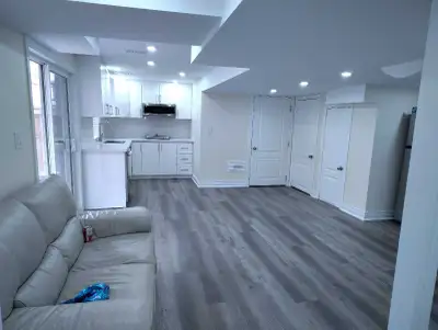 This newly renovated, modern basement apartment features bright, open-concept living spaces with upd...