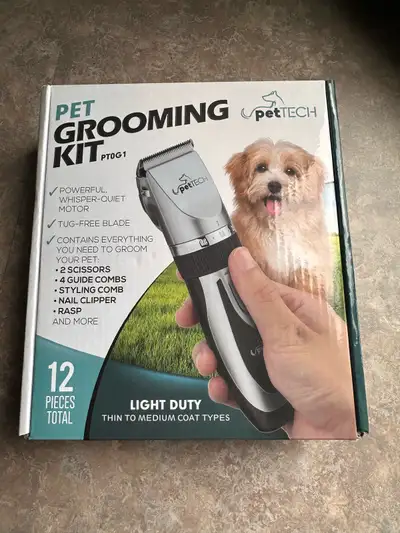 Pet grooming kit. Used only once. * 2 scissors * 4 guide combs * styling comb * nail clipper * rasp