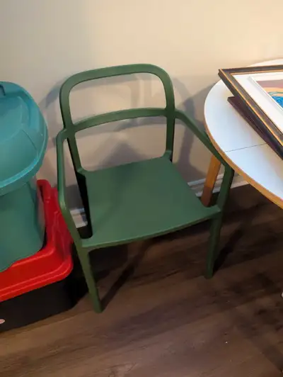 A green plastic chair originally from Ikea!