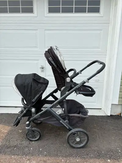 UppaBaby Vista Double Stroller, with two rumble seats and attachments for both the top and the botto...