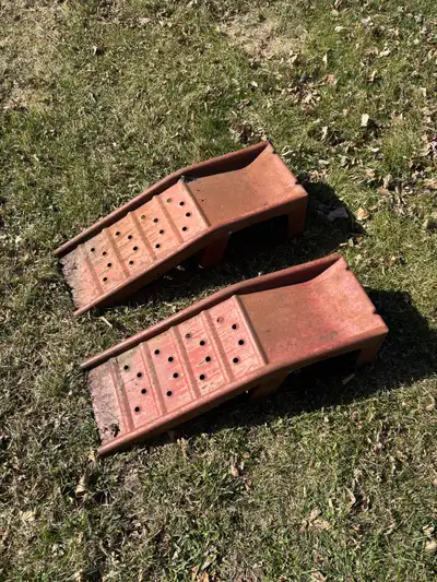 Used metal ramps for automotive repair.