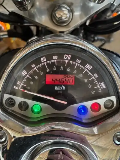 Windscreen, saddlebags, leather tank bra, engine bars with highway pegs, passenger seat with backres...