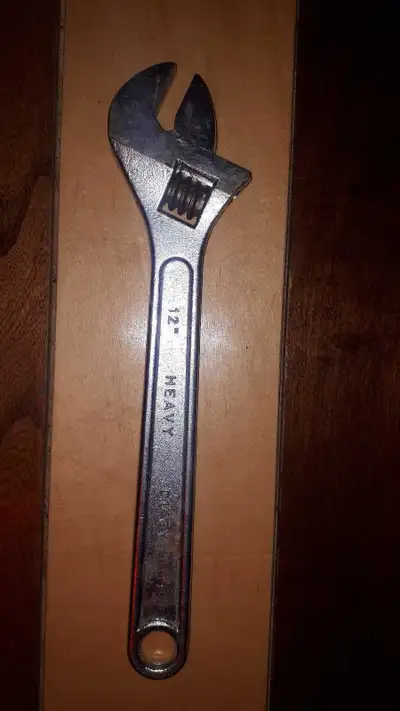 This is a used Heavy Duty 12" adjustable wrench, ready to tackle your toughest jobs! Being a well-lo...
