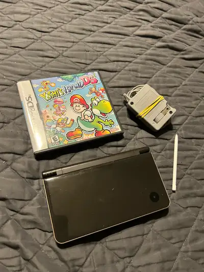 Nintendo DSi XL with Yoshi’s Island Game. Over all is good condition. Bottom screen has some wear bu...