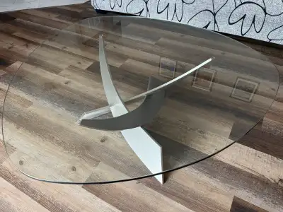 Selling coffee table. Glass top and stainless steel base.