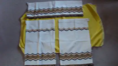 In very nice condition. Quality fabric with trim. Valance measures 60 X 9 inches. Each curtain panel...