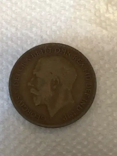This 1920 one Penny coin is a piece of history! Given its age, it shows signs of circulation and wea...