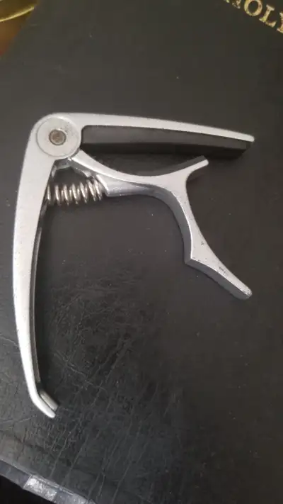 Guitar Capo with Bridge Pin puller . What a handy Capo to own . In person only . No shipping or othe...