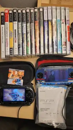 2 Sets of PSP 1001 Includes original charging cable with cases Light wear and tear but fully functio...