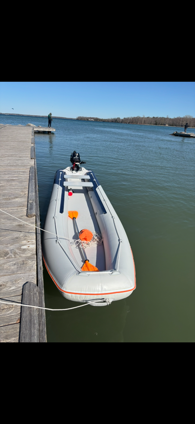 Selling a boat with a motor, including an electric pump, seat pads, and transom wheels for easy tran...