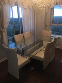 Glass table with 6 off white leather chairs