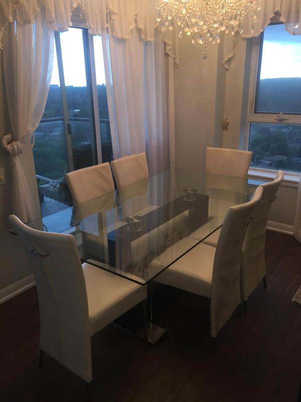 Glass table with 6 off white leather chairs in Dining Tables & Sets in City of Toronto