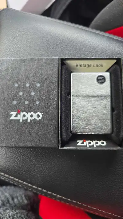 This Zippo lighter has a vintage look and is in new condition, complete with its original box, makin...