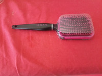 Black and Pink Avon brush / comb. Brand new
