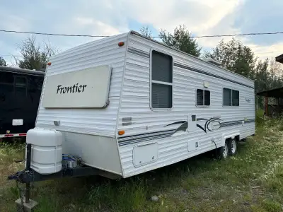 2002 Frontier 27’ travel trailer. Bunk beds. Full bath. dining table bed. Couch. Kitchen. Separate f...