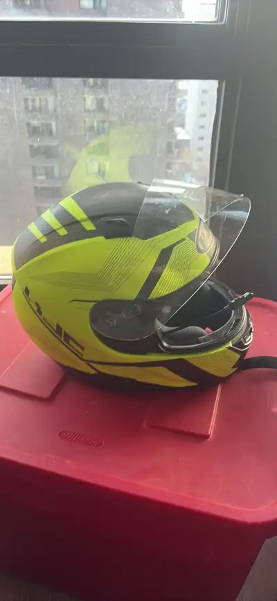 Motorcycle helmet with a microphone and snow/rain eye cover, size large.