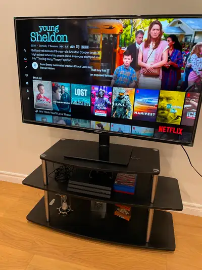 Toshiba 50” 4K Fire TV with rotating TV stand and TV table, View more