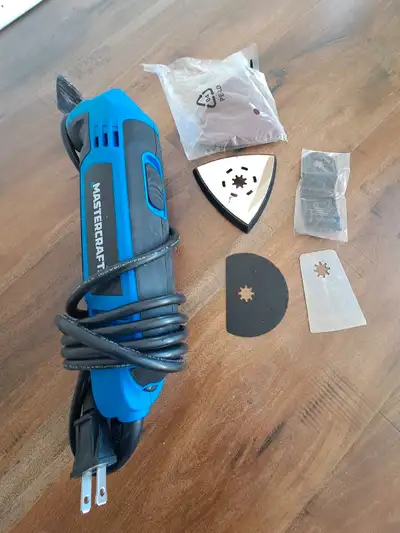 Oscillating tool with set of blades and sanding kit. Variable speed, 2.5 Amp. Used once, I'm selling...