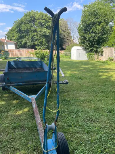 This trailer was used to tow a small sailboat. The mast support needs to be welded. It needs new whe...