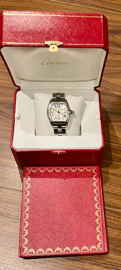 Selling a used Cartier Roadster 2510, a stylish timepiece with an automatic movement and stainless s...