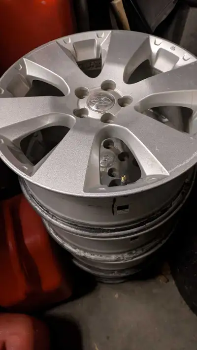 4 OEM Subaru Crosstrek Impreza rims with center caps. These are 5 x 100mm stud spacing for the Cross...