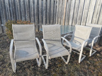 four chairs and a table outdoor