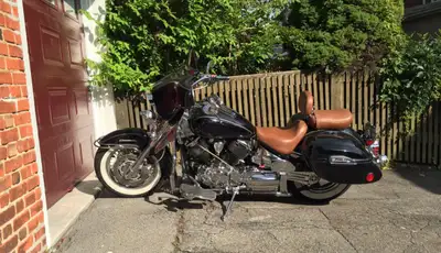 Highly customized, with batwing, extensive chrome throughout, lowered suspension, highway pegs, cd /...