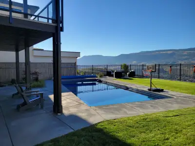 Newer custom home with in-ground pool and unobstructed views. Home offers nannies quarters and high-...