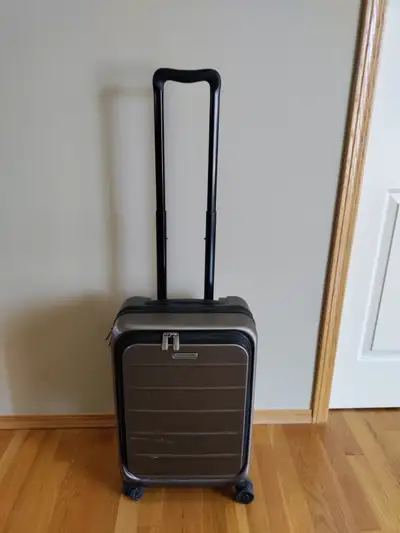 Used Ricardo Carry on Rolling Luggage for sale. Having USB port. Color: brown Size: 9" X 13.5" X 21....