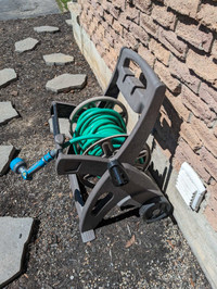 Garden hose wheel holder