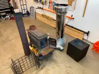 Wood stove with chimney and pipe, etc.